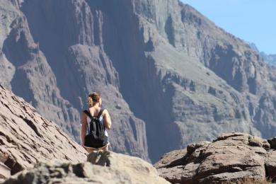 a student hiking in the Andes Mountains in Chile