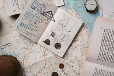 A student's passport laying on a map