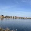 Picture of Copenhagen in the distance with water dividing the camera and the city on a sunny early March afternoon.