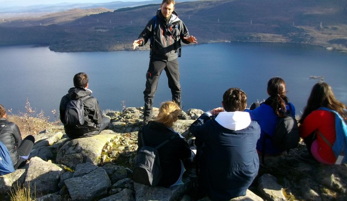 Local tour guide telling students about the Sanabria Lake legend