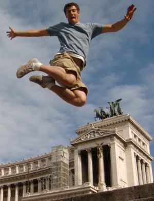 a student jumping for a fun photo at Altar of the Fatherland