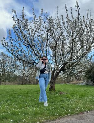 london student in front of tree