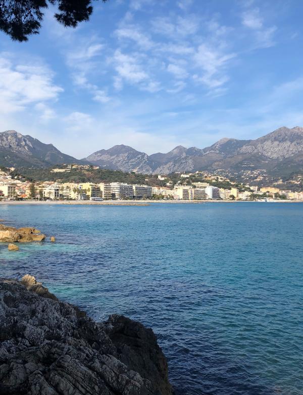blue inlet with mountains and blue sky